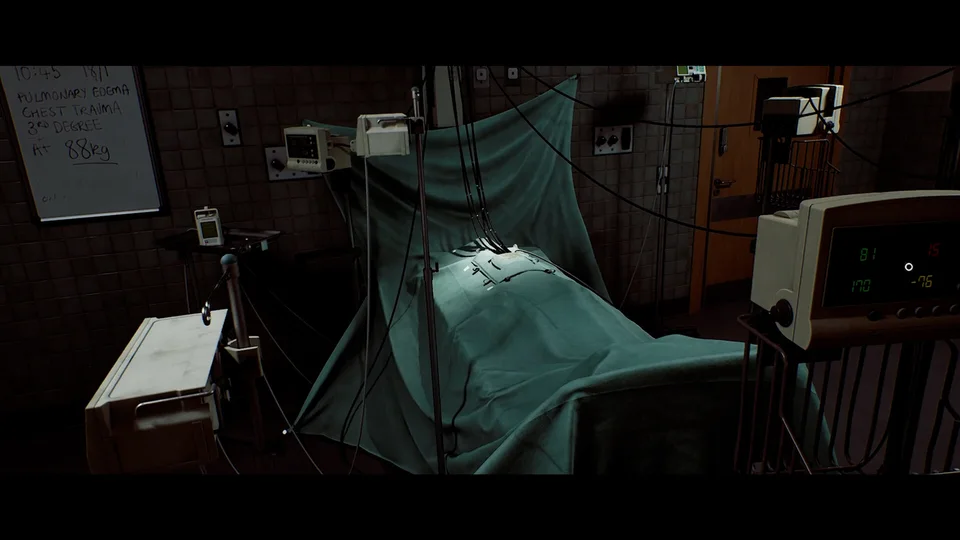 A covered hospital bed surrounded by cables, monitors and equipment